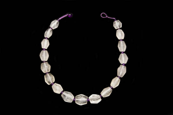 A Necklace Of Seventeen Javanese Frosted Glass Facetted Ridged Oval Beads With Amethyst Round Spacers