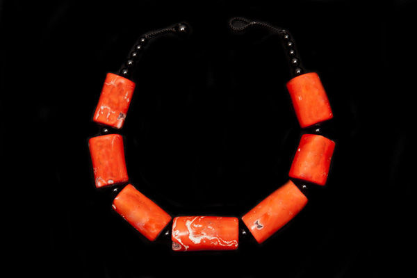 A Necklace Of Seven Chinese Orange Dyed Sea Bamboo Coral Tubular Beads With Black Agate Spacers And Beads