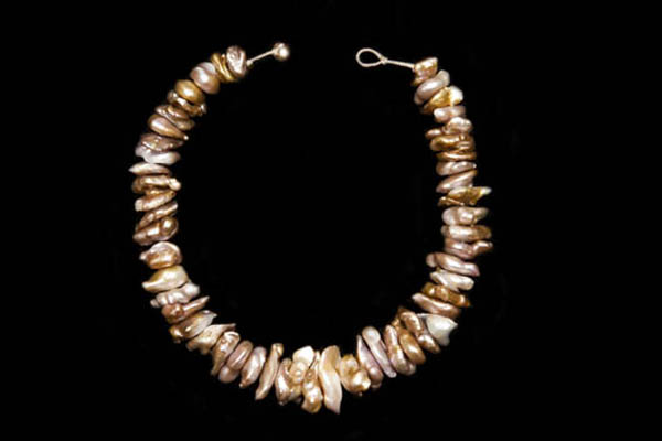 A Necklace Of Large Graduated Irregular Shaped Gold And White Freshwater Blister Pearls.
