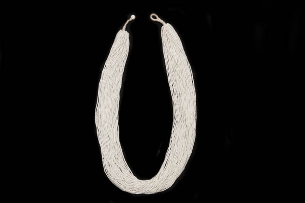 A Mali Long Necklace Of Fifty Strands Of Small White Glass Beads