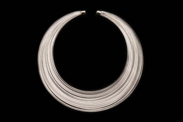 A Silvered Metal Multi-Band Tapered Open Circular Torque Necklace