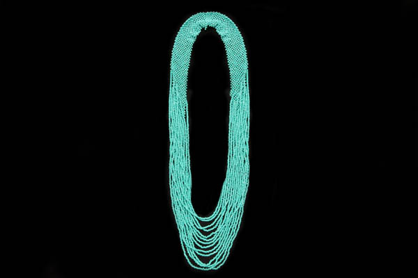 A Long Sixteen Graduated Strands Necklace Of Small Turquoise Resin Beads With A Crochet Bead Band At The Top