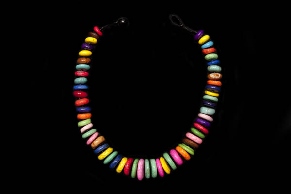A Necklace Of Multicoloured Dyed Howlite Graduated Discs With Black Agate Small Round Spacers