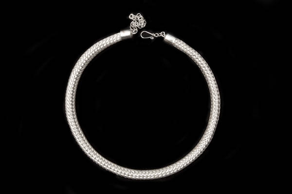 A Silvered Metal Circular Necklace Of A Plaited Wires Hollow Tubular Band