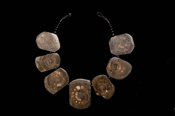 A Necklace Of Seven Large Dark Brown Stone Drops Each Containing An Ammonite Fossils