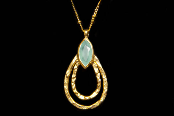 A Gold Plated Chain Necklace With A Double Loop Teardrop Decorated With An Aquamarine Facetted Cabochon