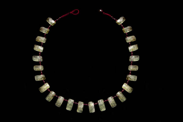 A Necklace Of Twenty-Four Moss Agate Rectangular Facetted Drops With Small Round Garnet Spacers