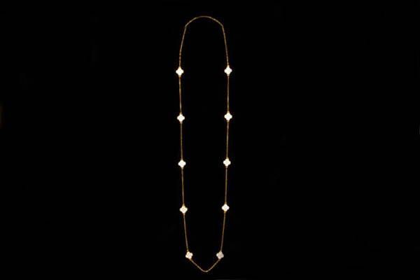 A Gold Plated Long Chain Necklace With Ten White Enamel 'Four Leaf Clovers' In  Gold Plated Frames