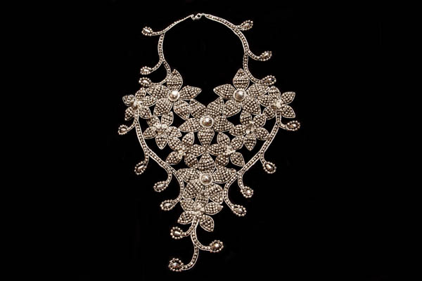 A Large Floral Patterned Necklace Decorated With Small Silvered And Metallic Brown Facetted Glass Beads And Cabochons