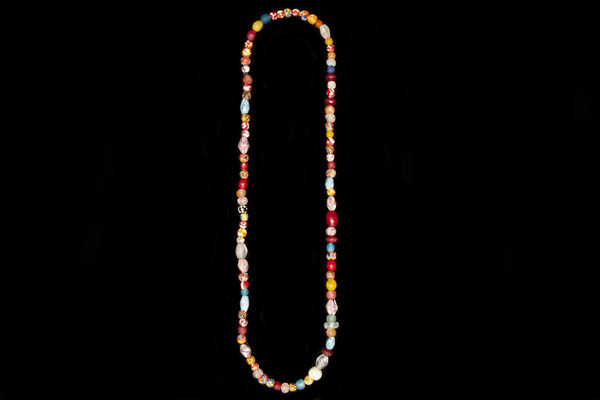 A Long Necklace Of Multicoloured, Mixed Shaped And Sized, Plain And Patterned Glass Beads