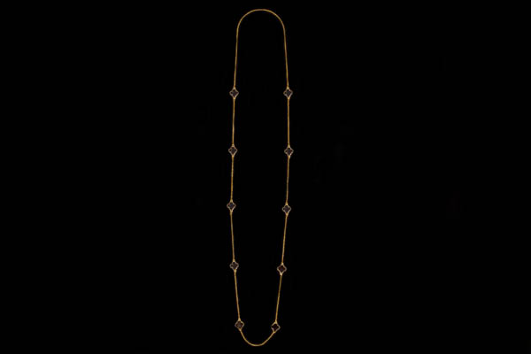 A Gold Plated Fine Chain Long Necklace With Ten Black Enamel  'Four Leaf Clovers' In Gold Plated Frames