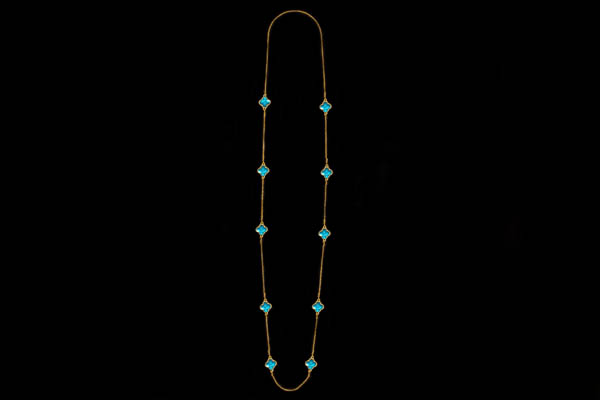 A Gold Plated Fine Chain Long Necklace With Ten Turquoise Enamel 'Four Leaf Clovers' In Gold Plated Frames