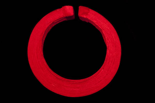 A Vietnamese Large Traditional Torque Open End Necklace Covered In Bands Of Red Velvet