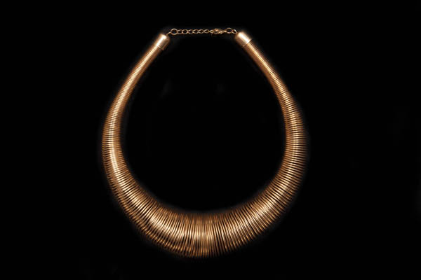 A Golden Metal Graduated Coiled Wire Band Necklace