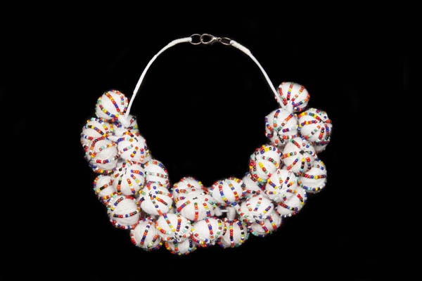 A Necklace Of White Wool Covered Round Bunched Beads,Each Decorated With Lines Of Small Multicoloured Glass Beads