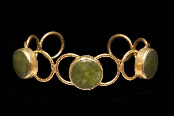 A Gold Plated Ten Rings Open Cuff Decorated With Three Green Dyed Agate Circular Facetted Cabochons