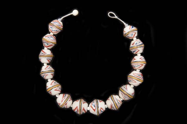 A Necklace Of Javanese Ridged White Glass Beads, Each Decorated With Multicoloured Patterned Lines