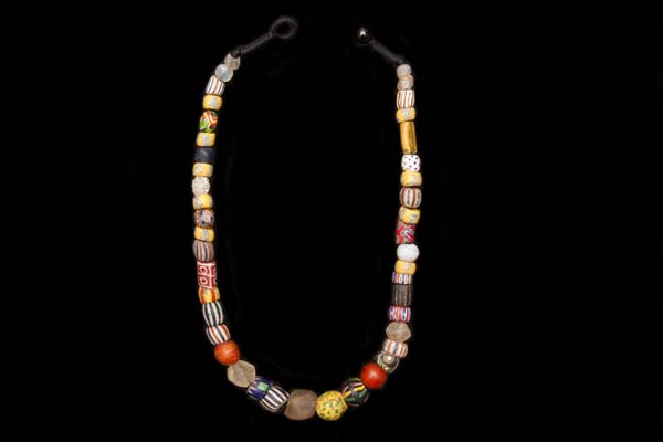 A West African Necklace Of Antique Bohemian, Venetian, Krobo, and Dutch Multicoloured And Patterned Glass Trade Beads
