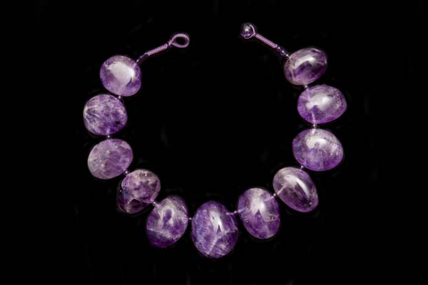 A Necklace Of Eleven Large Graduated Brazilian Amethyst Oval Drops With Brazilian Amethyst Small Round Spacers