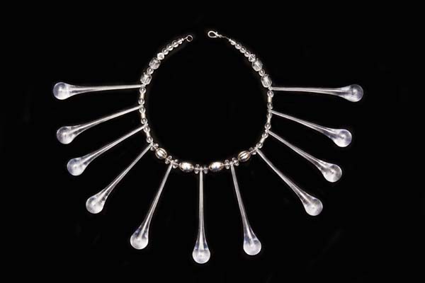 A  Necklace Of Eleven Clear Resin Long Teardrops And Clear And Silvered Mixed Shaped Resin Beads