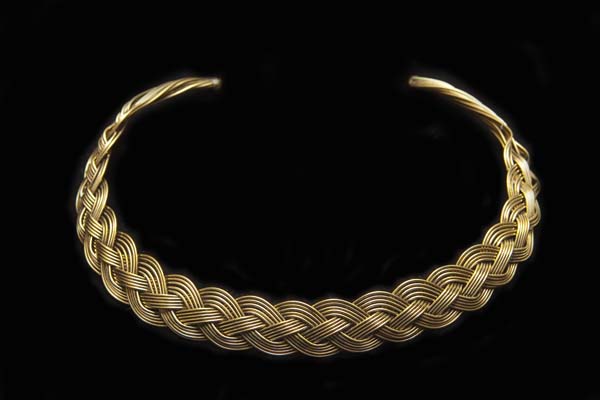An Open Torque Necklace Of Eight Golden Metal 'Celtic Weave' Interlocking Curved Braided Bands
