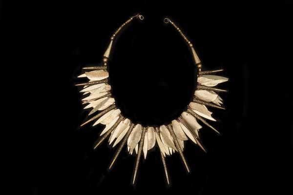 A Necklace Of Golden Metal Patterned Spiked Drops, Leaf And Oval Flat Drops And Mixed Shaped Beads