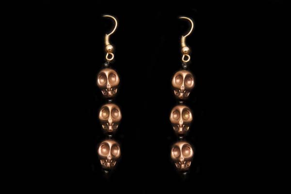 A Pair Of Three Copper Skull Drops Earrings With Black Onyx Small Round Spacers