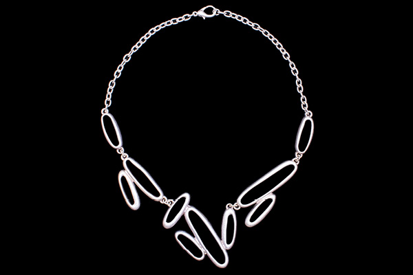 A Silvered Metal Chain Links Necklace With Ten Silvered Metal Mixed Sized Narrow Bands