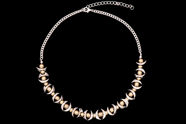 A Silvered Metal Chain Necklace With Golden Metal Round Beads And Silvered Metal Curved Oval Bars