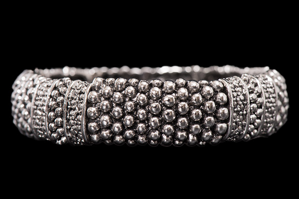 A Silvered Metal Eight Bar Elasticated Bracelet, Each Bar Decorated With Mixed Sized Round Beads