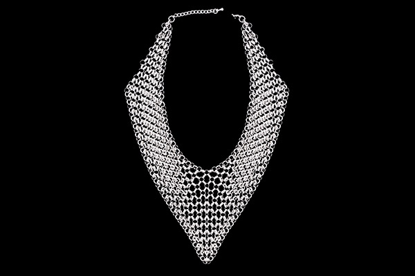 A Silvered Metal Multi-Strand Chain Links Triangular Shaped Necklace Made From Interlocking Rings