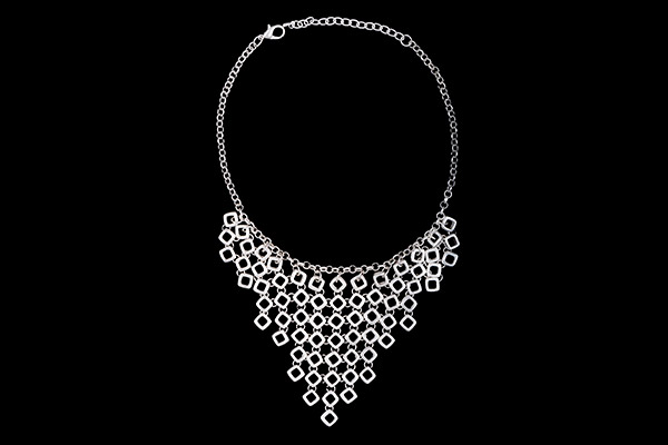 A Matt Silvered Metal Triangular Panel Necklace Composed Of Linked Diamond Shaped Small Beads