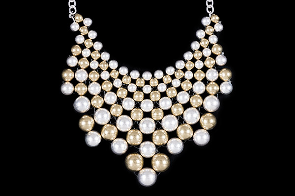 A Triangular Shaped Panel Necklace Of Golden And Silvered Metal  Graduated Round Beads