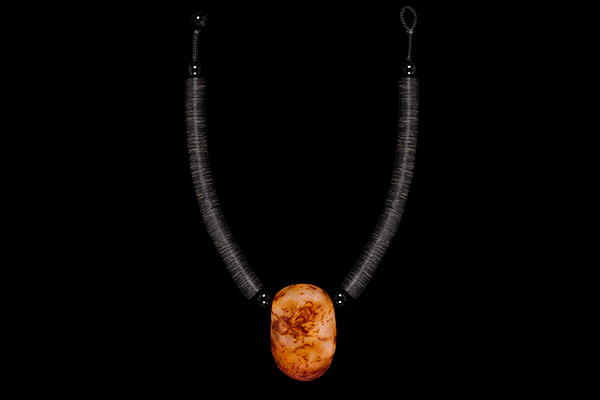 A Madagascar Cornelian Natural Patterned Deep Oval Pendant On A Black Bakelite Thin Discs Necklace