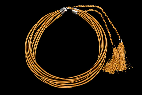 A Necklace Of Ten Golden Thread Covered Bands Encased, At Each End, In Silvered Metal Domed Caps