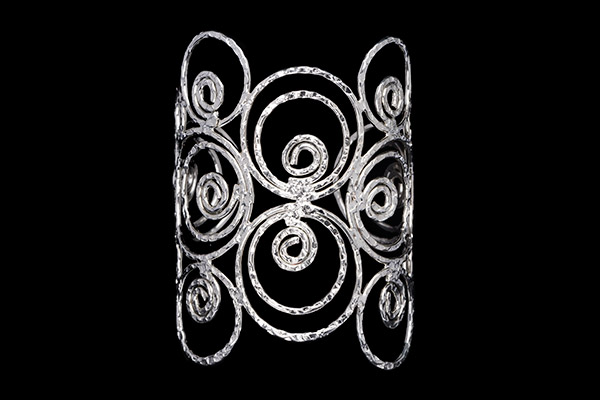 A Silvered Metal Long Open Cuff Of Hammered Surface Bands Of Coiled And Concentric Circular Rings