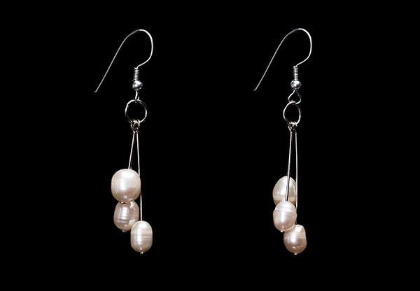 A Pair Of Silver Wire Three Drops Earrings, Each wire With An Oval White Freshwater Pearl Pendant
