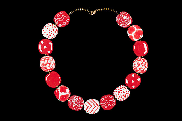 A Kenya Necklace Of Red And White Hand Painted And Patterned Ceramic Flat Oval Beads