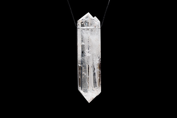A Brazilian Rock Crystal Long Facetted Double Pointed Pendant On A Black Leather Thong Necklace