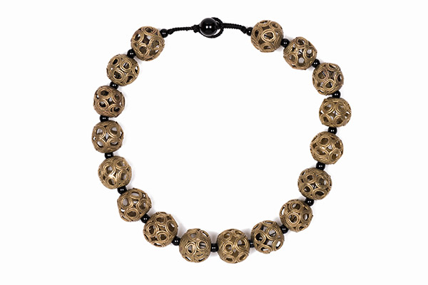 A Necklace Of West African Round Hollow Brass Beads Decorated With Circular Patterned Bands