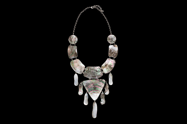 A Silvered Metal Chain Necklace With Fifteen Abalone Shell Silvered Metal Framed Beads And Pendants