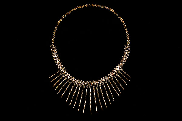 Twenty-Three Golden Metal Patterned Graduated Tubular Drops On A Golden Metal Chain Links Necklace