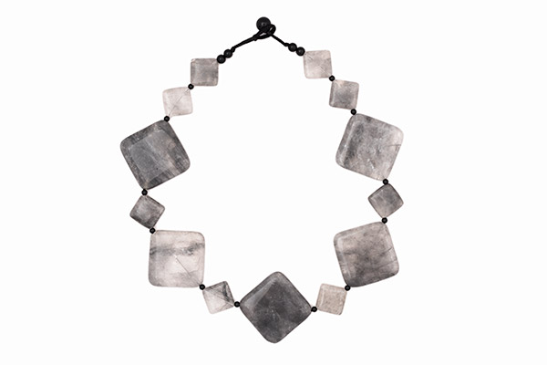 A Necklace Of Five Large And Eight Small Diamond Shaped Rock Crystal Beads With Grey Inclusions
