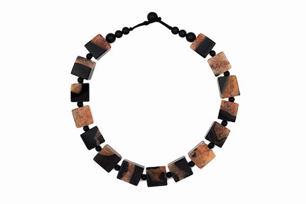 A Necklace Of Fifteen Orange And Black Dyed Crystal Polished Cubes With Black Onyx Round Spacers