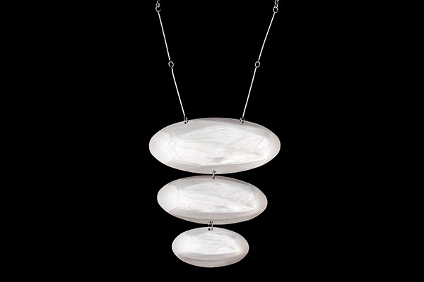 A Silvered Metal Bars And Chain Necklace With Three Silvered Metal Graduated Linked Oval Pendants