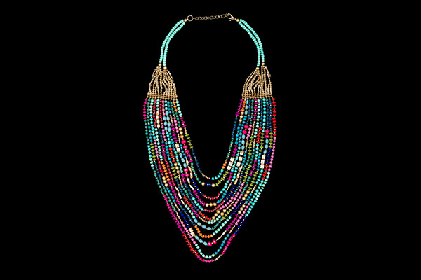A Twelve Graduated Strands Long Necklace With Small Golden And Multicoloured Resin Beads