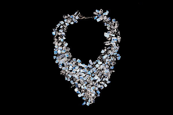 A Silvered Metal Wires Triangular Shaped Necklace Decorated With Opalite Glass Nuggets