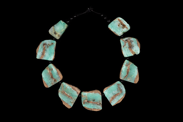 A Necklace Of Nine Green And Brown Chrysoprase Drops With Black Onyx Round Spacers And Beads