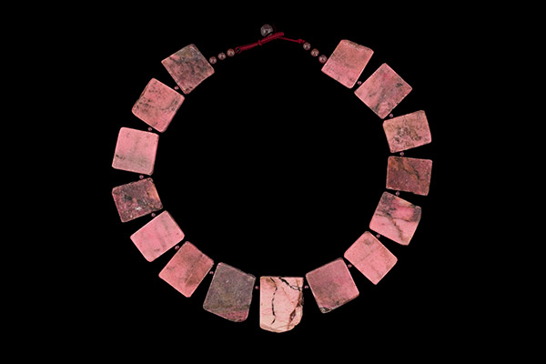 A Necklace Of Fifteen Pink Rhodonite Square And Rectangular Flat Beads With Garnet Round Spacers