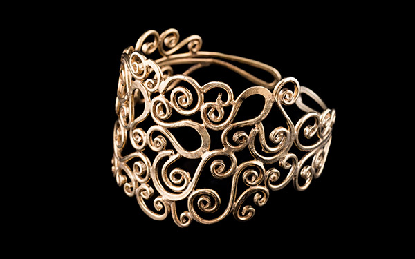 A Golden Metal Large Tapered Open Cuff/Armlet Decorated With A series Of Curled Bands